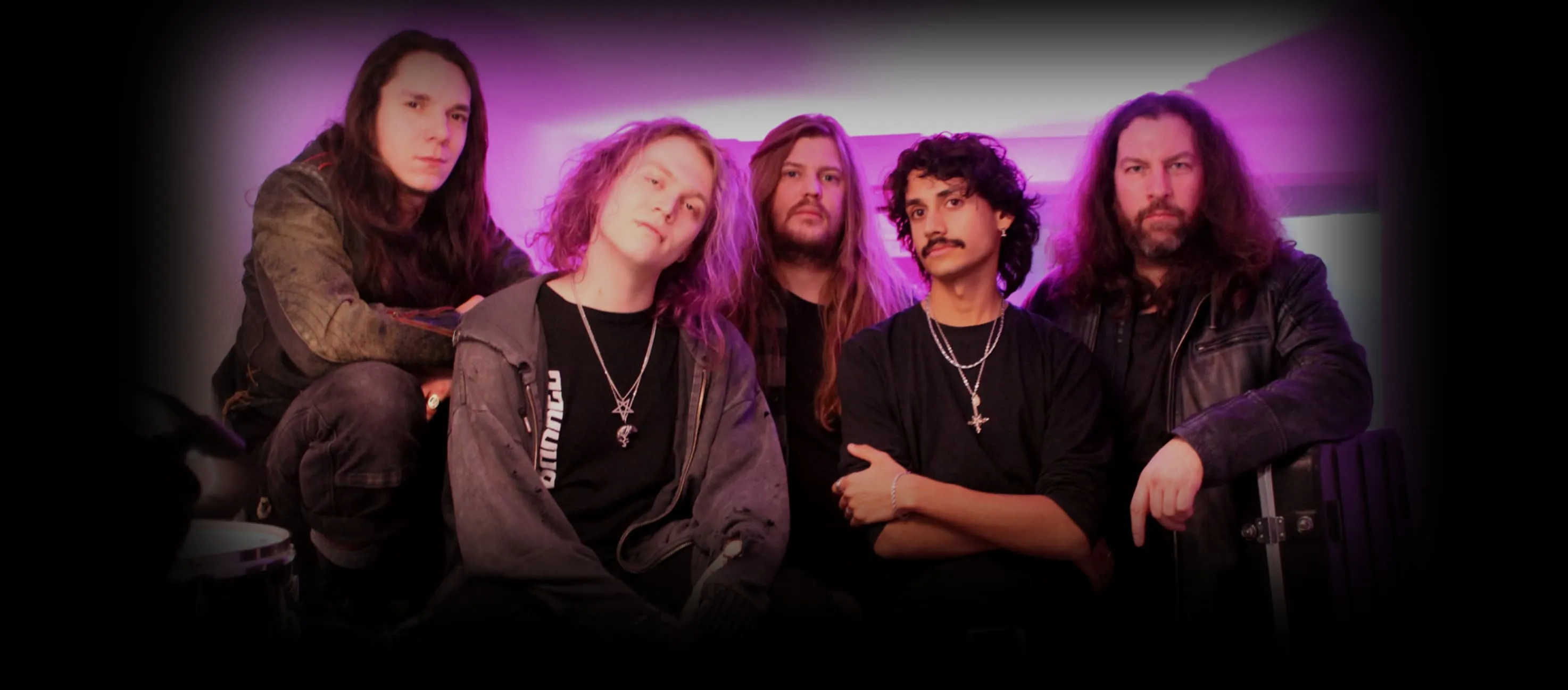 The five members of BARREL in violet light